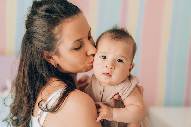 young-mother-hugs-her-mixed-race-child-child-adop-2021-09-02-08-07-28-utc